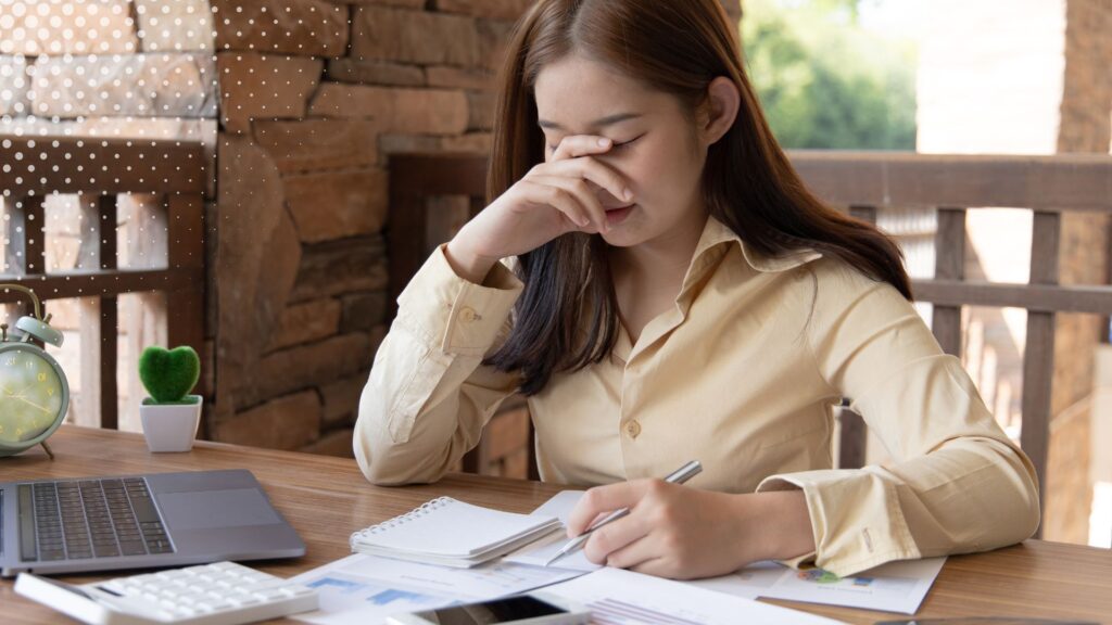 A woman struggling to file her taxes